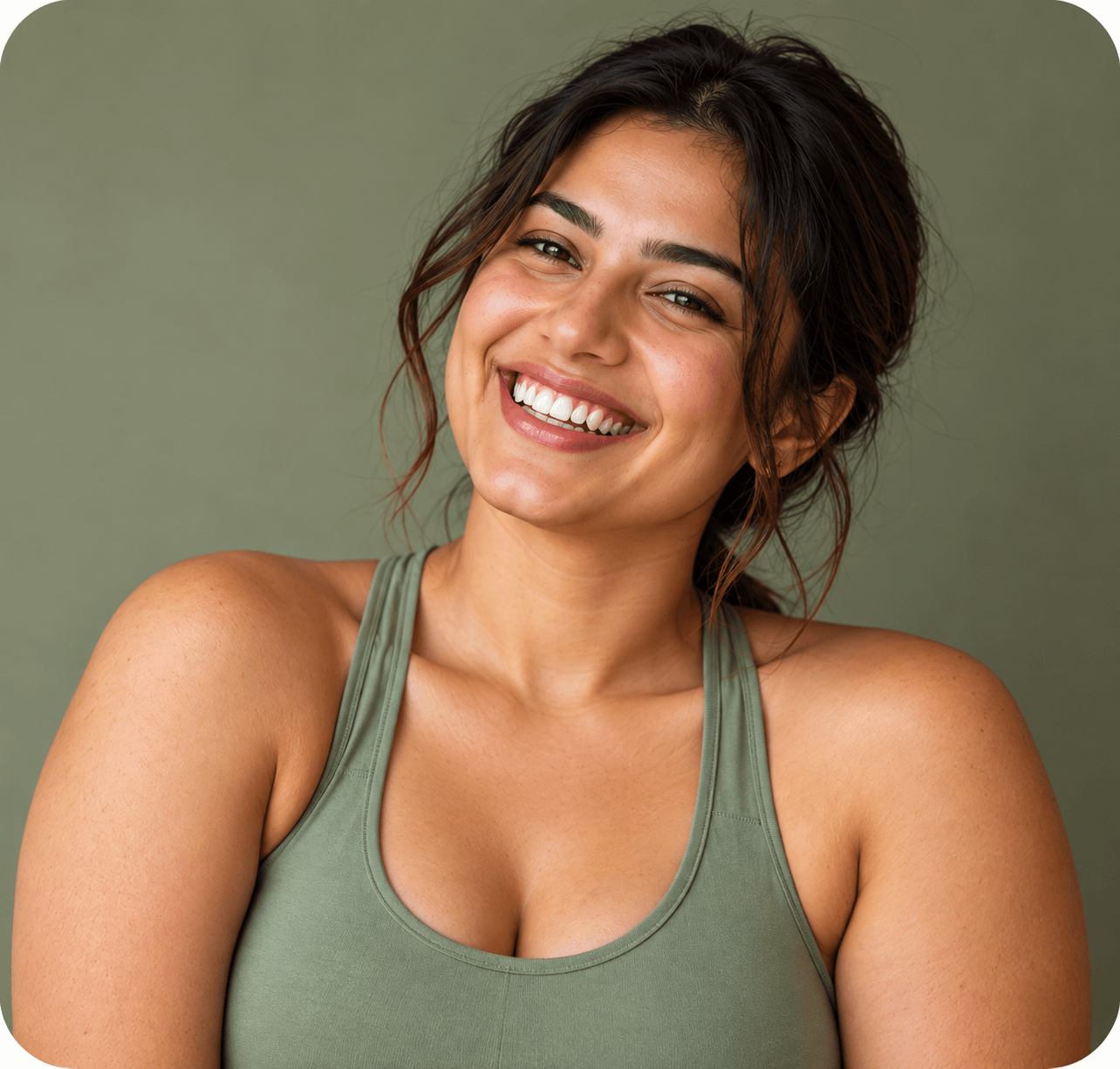 Smiling woman in a sage-green top