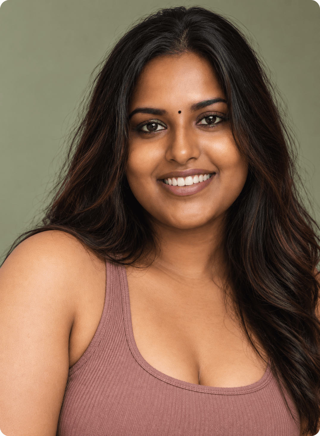 Smiling woman in a soft pink top