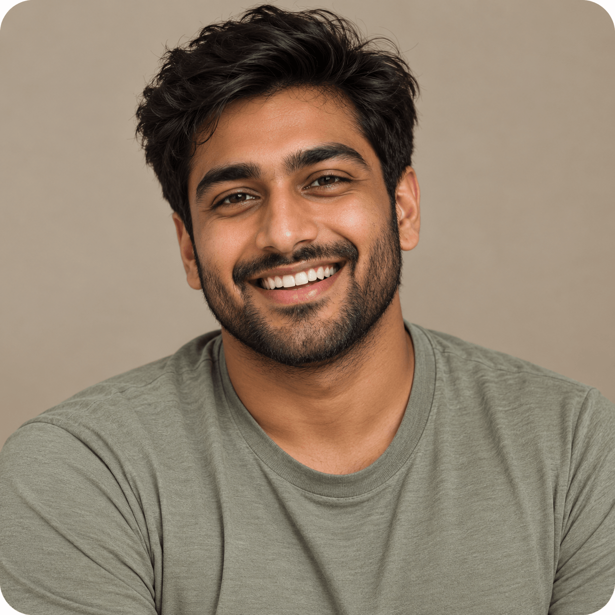 Smiling man in a sage-green shirt