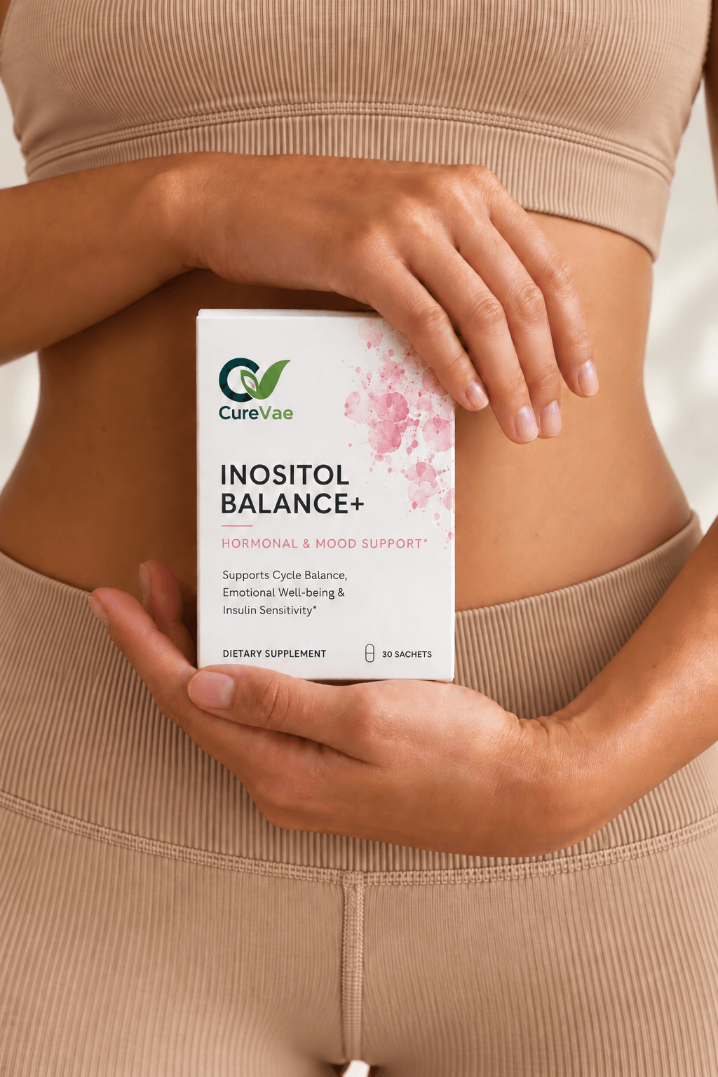 Woman holding a CureVae Inositol Balance+ carton